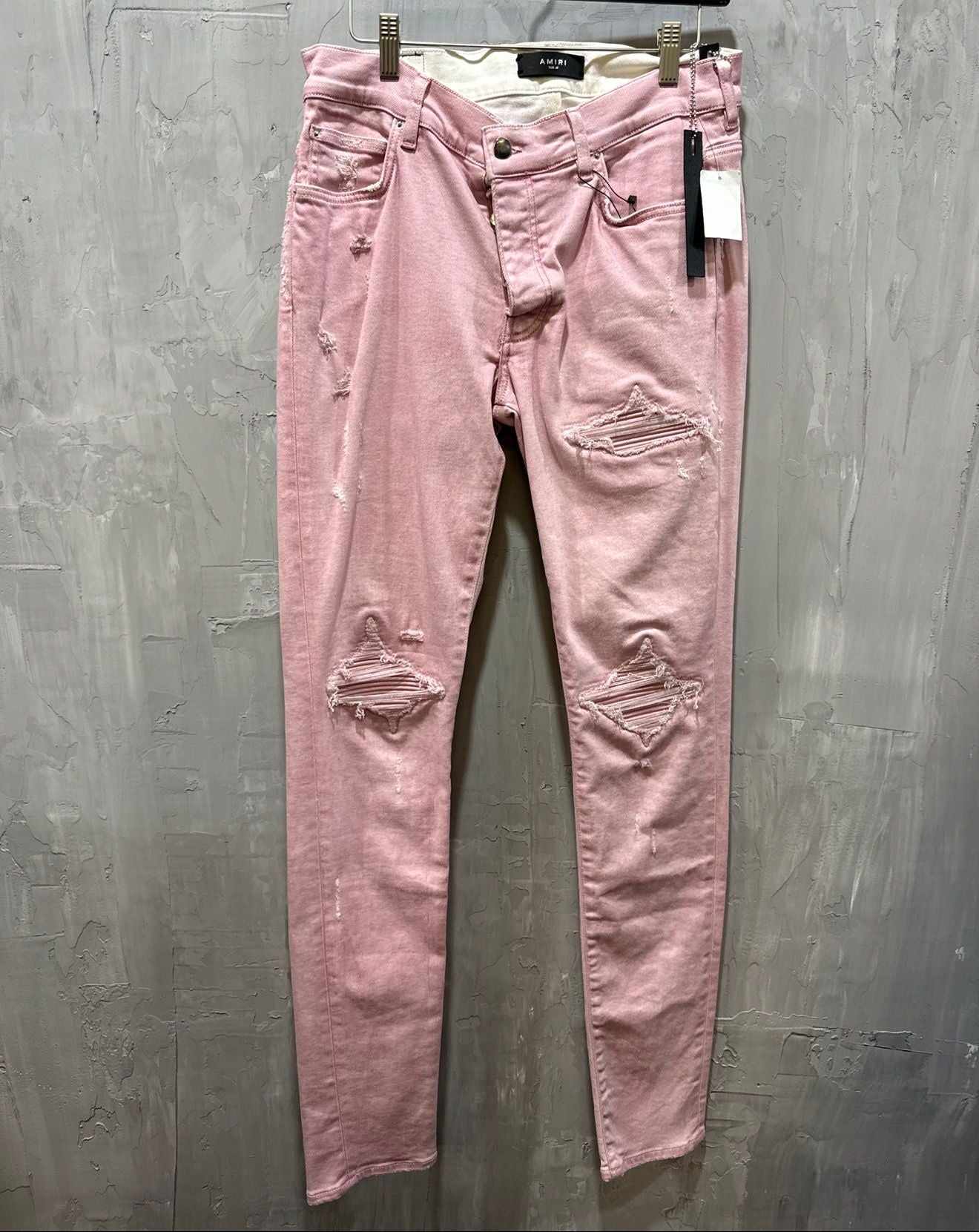 Sprayed pink MX1 denim jeans
