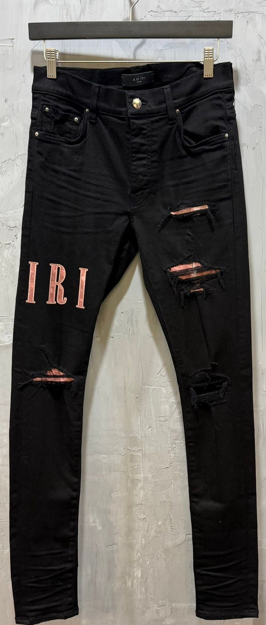 waxed logo-appliqué skinny jeans