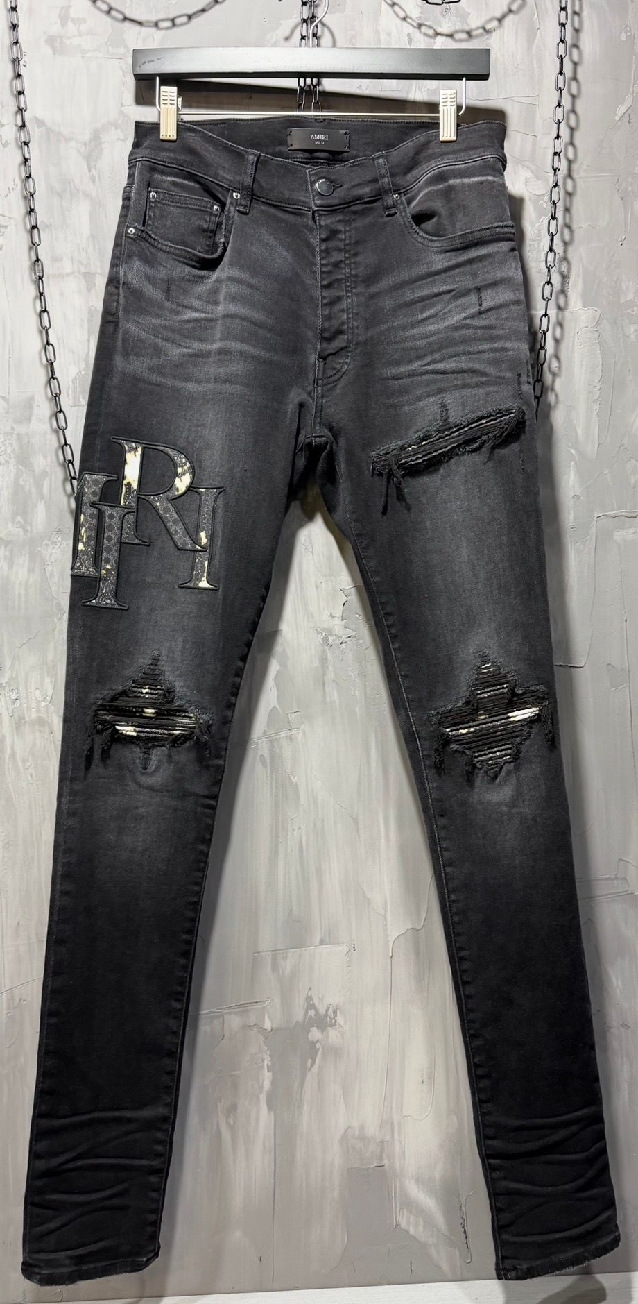 Amiri Staggered Logo Skinny Jeans