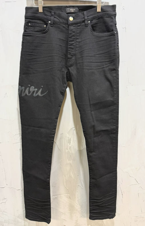 Amiri script logo jeans